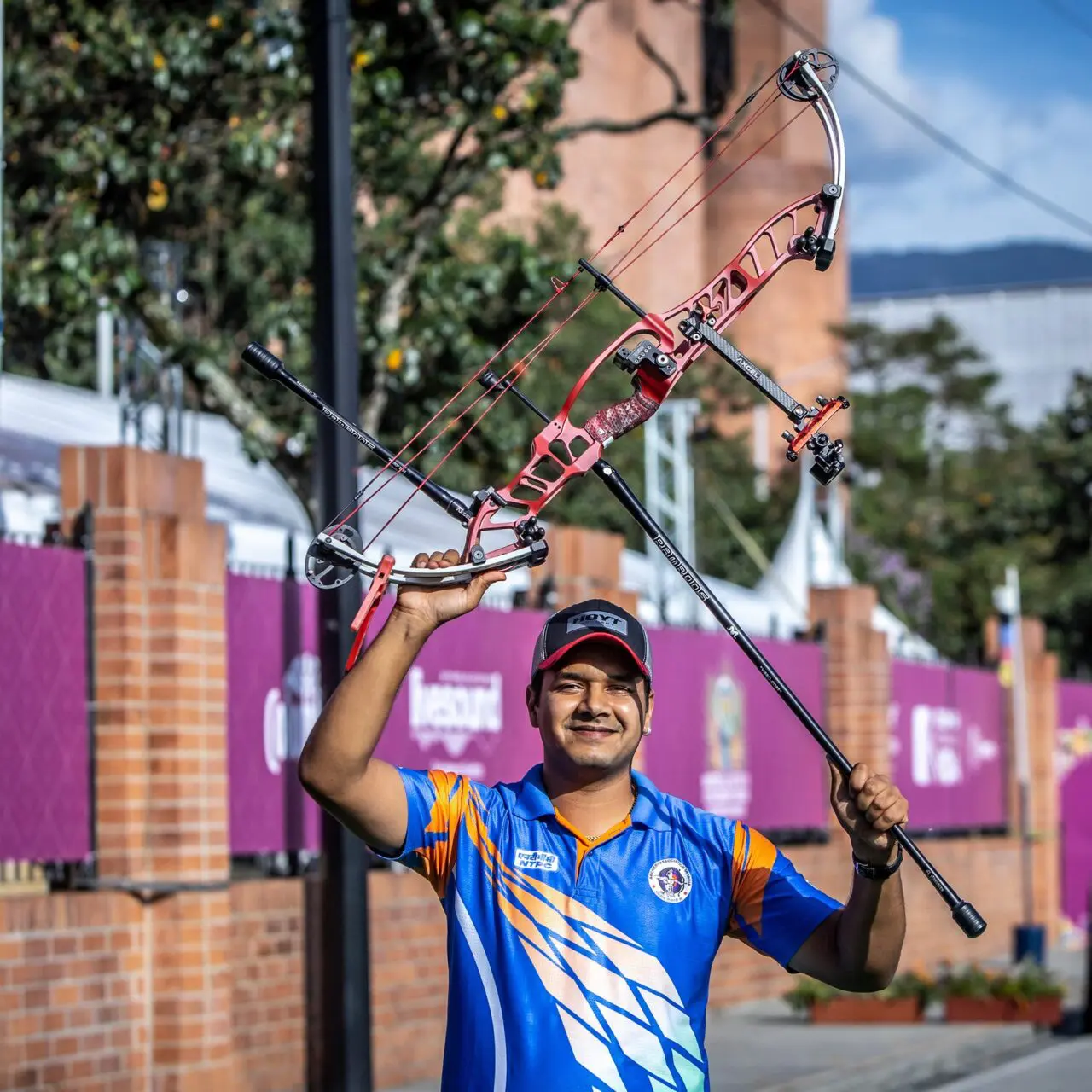 Abhishek Verma raising his bow after winning World Cup Medellin